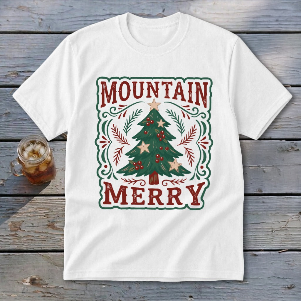 A white short-sleeved t-shirt featuring a vintage Christmas tree graphic with the text Mountain Merry.