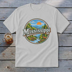 White t-shirt with a circular graphic of Mississippi landscape featuring text.