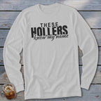 White long sleeve shirt with black text: THESE HOLLERS know my name