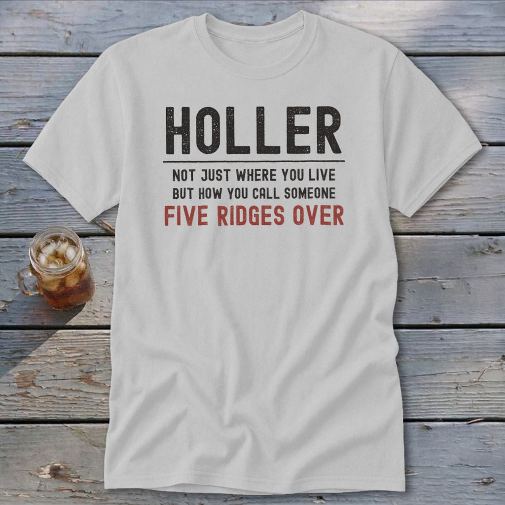 White t-shirt with "HOLLER NOT JUST WHERE YOU LIVE BUT HOW YOU CALL SOMEONE FIVE RIDGES OVER" text.