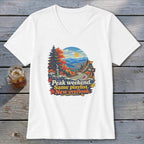 White v-neck t-shirt with mountain overlook graphic and text "Peak weekend. Same playlist. New overlook."