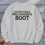White sweatshirt with black text reading "Colder Than a Welldigger's Boot."