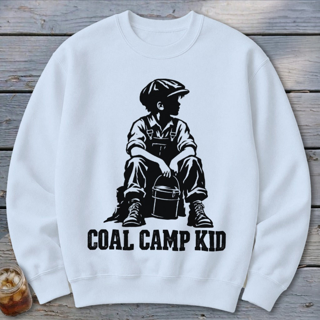 White sweatshirt with black graphic of a boy holding a bucket and the text "COAL CAMP KID."