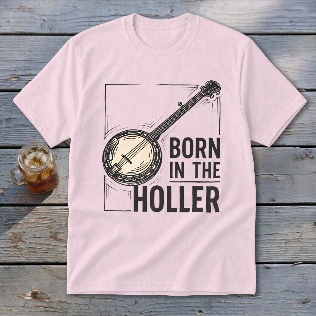 Light pink t-shirt with a banjo graphic and text "BORN IN THE HOLLER".