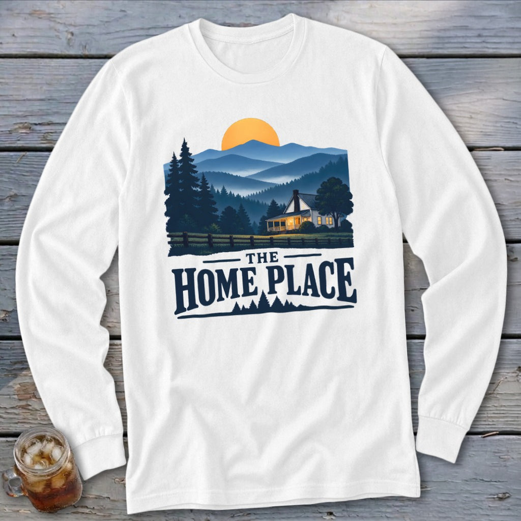White long-sleeve shirt with graphic of a house, mountains, and text "The Home Place".