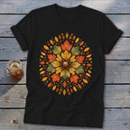 Black t-shirt with a circular autumn leaf and acorn design.