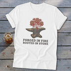 White t-shirt with anvil graphic and text "FORGED IN FIRE ROOTED IN STONE".