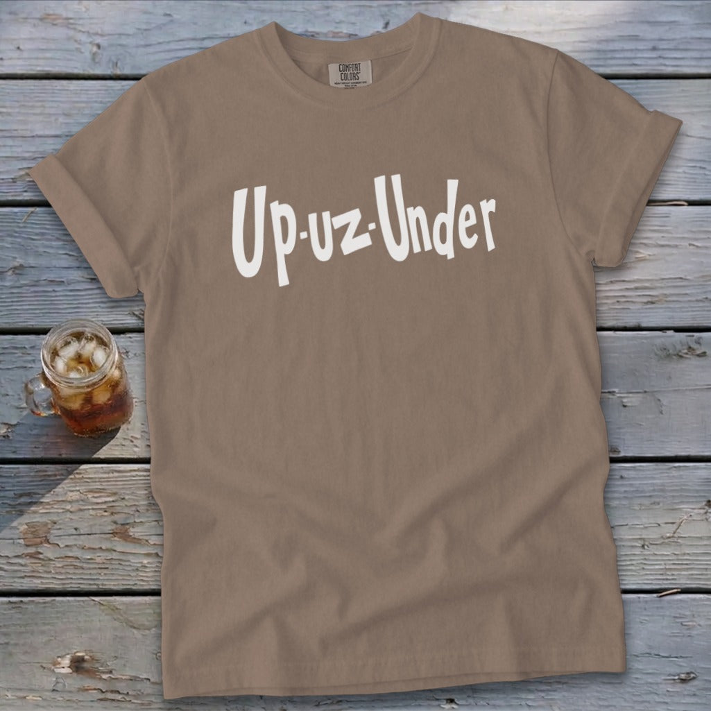 Brown t-shirt with white text "Up-uz-Under" and a glass of iced tea.