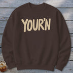 Brown crewneck sweatshirt with "YOUR'N" in cream text.