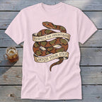 Pink t-shirt with coiled snake graphic and text "Respect the mountains watch your step."
