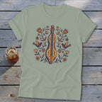 T-shirt with folk art style dulcimer, birds, and floral design.