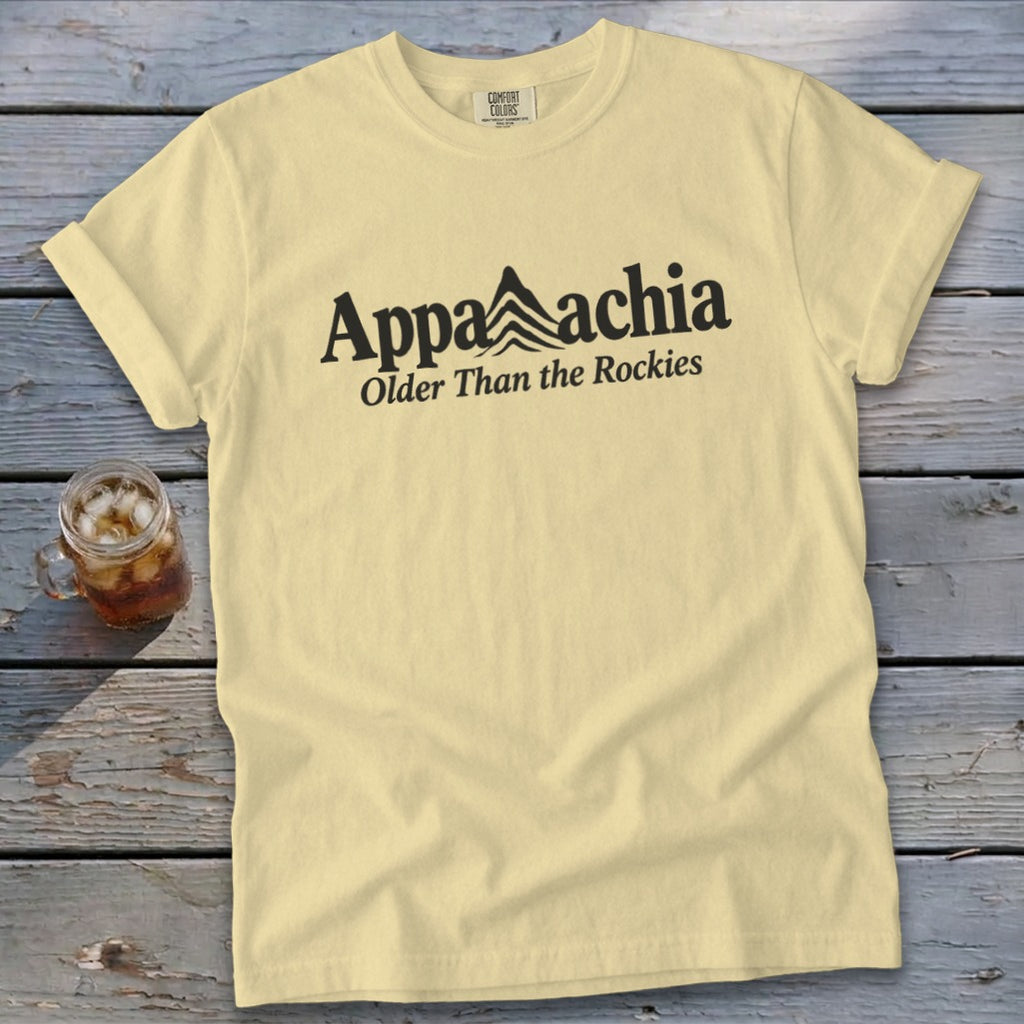 Yellow t-shirt with black text "Appalachia Older Than the Rockies" and mountain graphic.