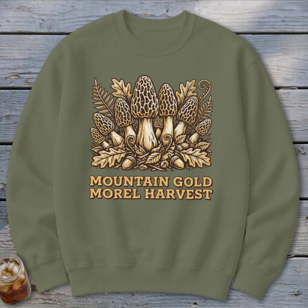 Olive green sweatshirt with a "Mountain Gold Morel Harvest" graphic of morel mushrooms.