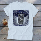 White t-shirt with a dark blue graphic of fireflies in a jar against mountains and moon.