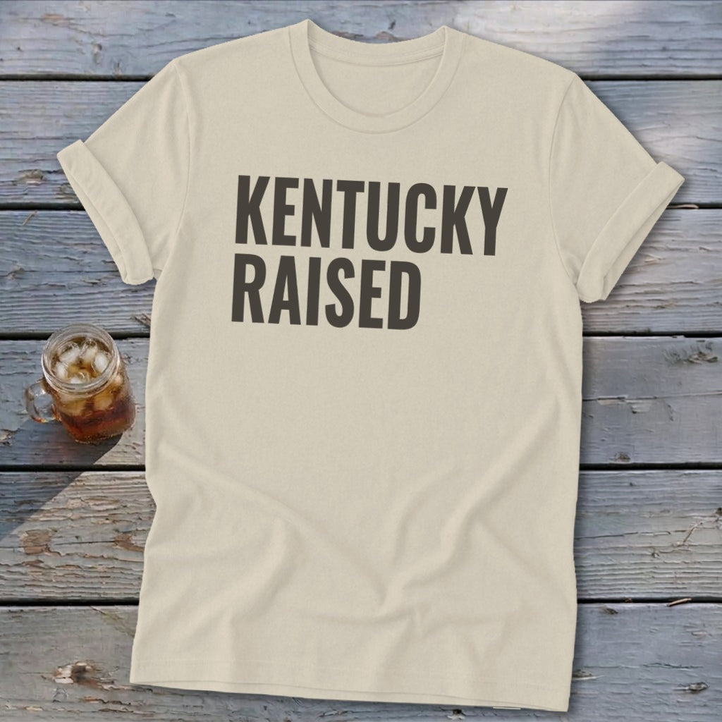 Cream t-shirt with "KENTUCKY RAISED" text and a glass of iced tea.
