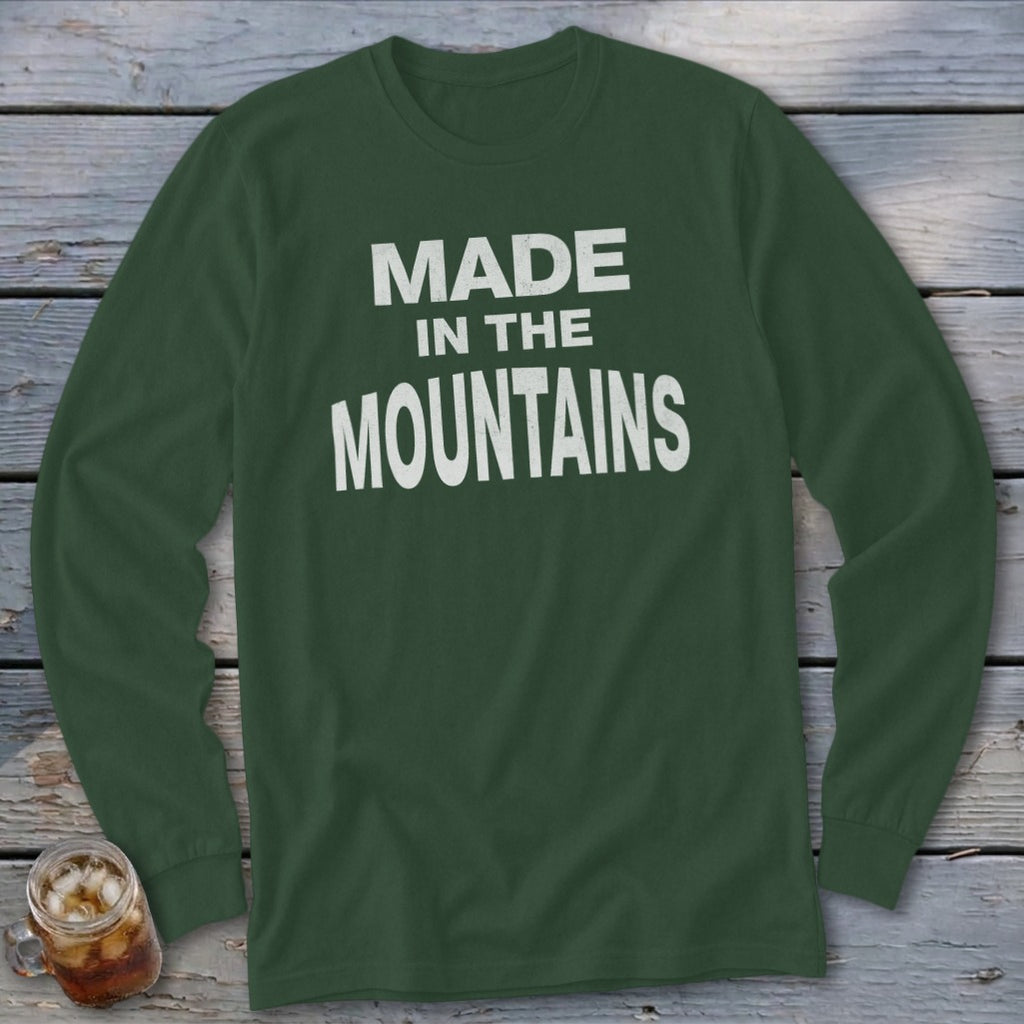 Dark green long-sleeve shirt with "MADE IN THE MOUNTAINS" printed in white.