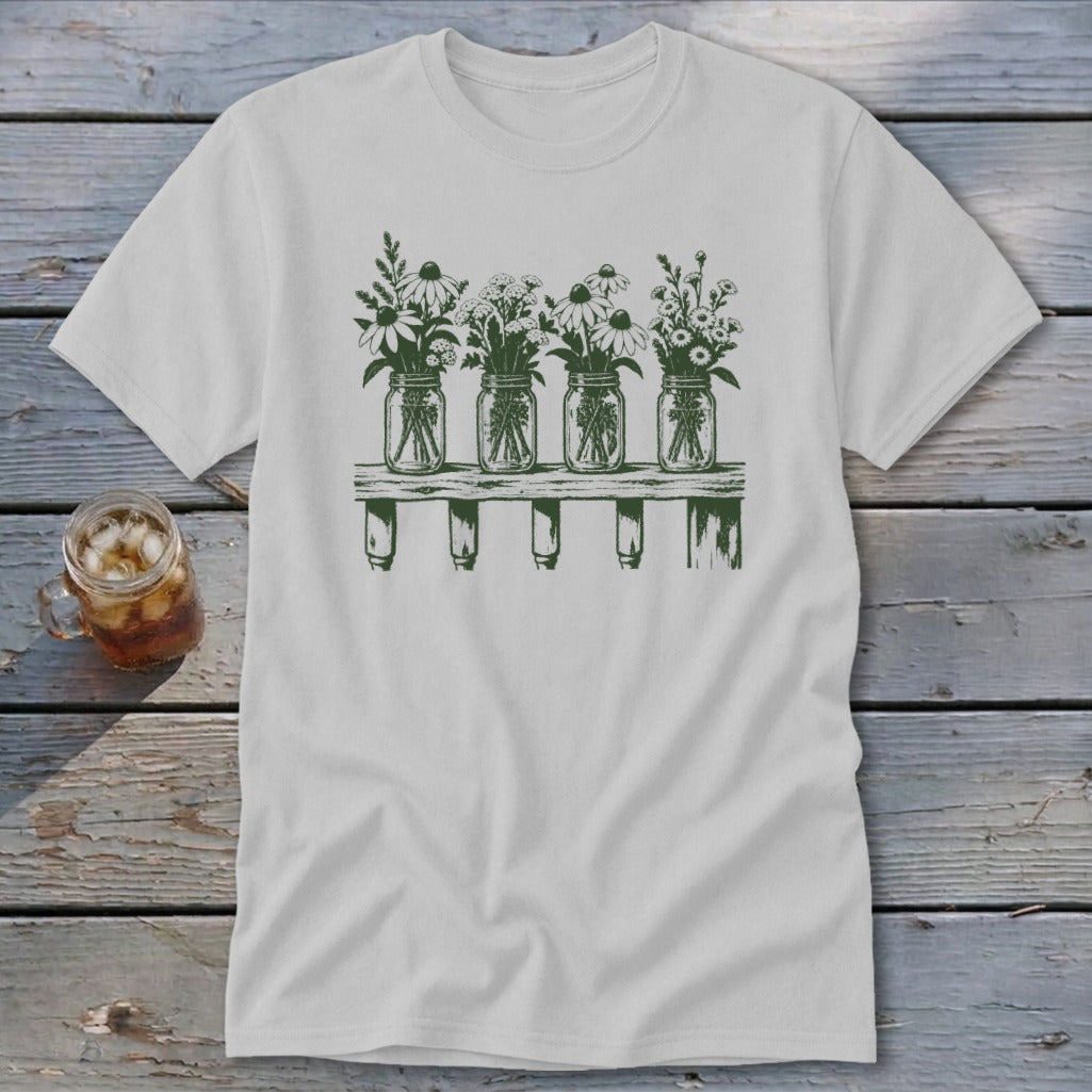 Light gray t-shirt featuring a green graphic of four mason jars filled with wildflowers on a shelf.