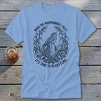 Light blue t-shirt featuring a black graphic of a bird on a post and corn stalks.