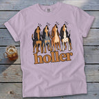 Four hounds with open mouths above the text "holler" on a purple t-shirt.