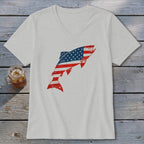 Light gray V-neck t-shirt featuring a distressed American flag fish graphic laid flat on weathered wood.