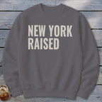 Gray sweatshirt with "NEW YORK RAISED" text in off-white.