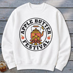 White sweatshirt with "Apple Butter Festival" logo featuring a kettle over a campfire.