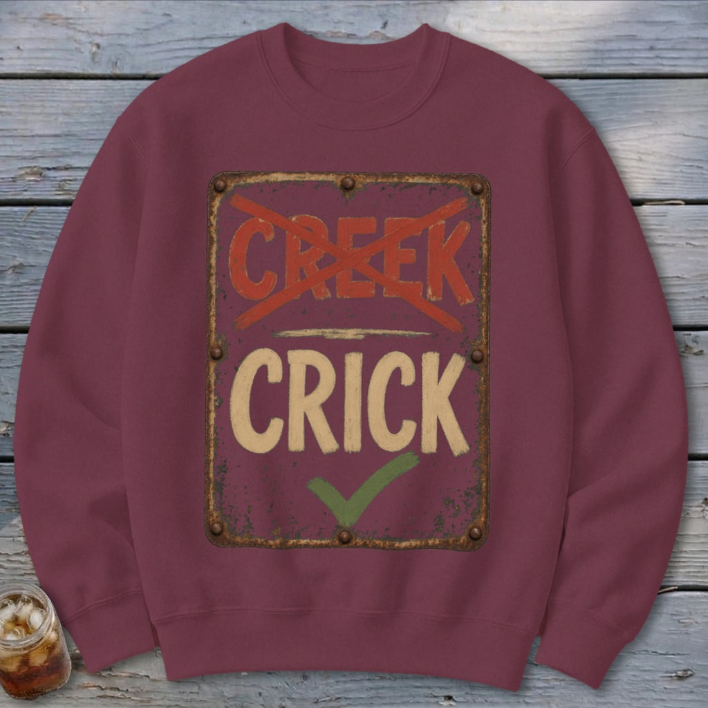 Maroon sweatshirt with a distressed sign that reads "CRICK" with a checkmark.