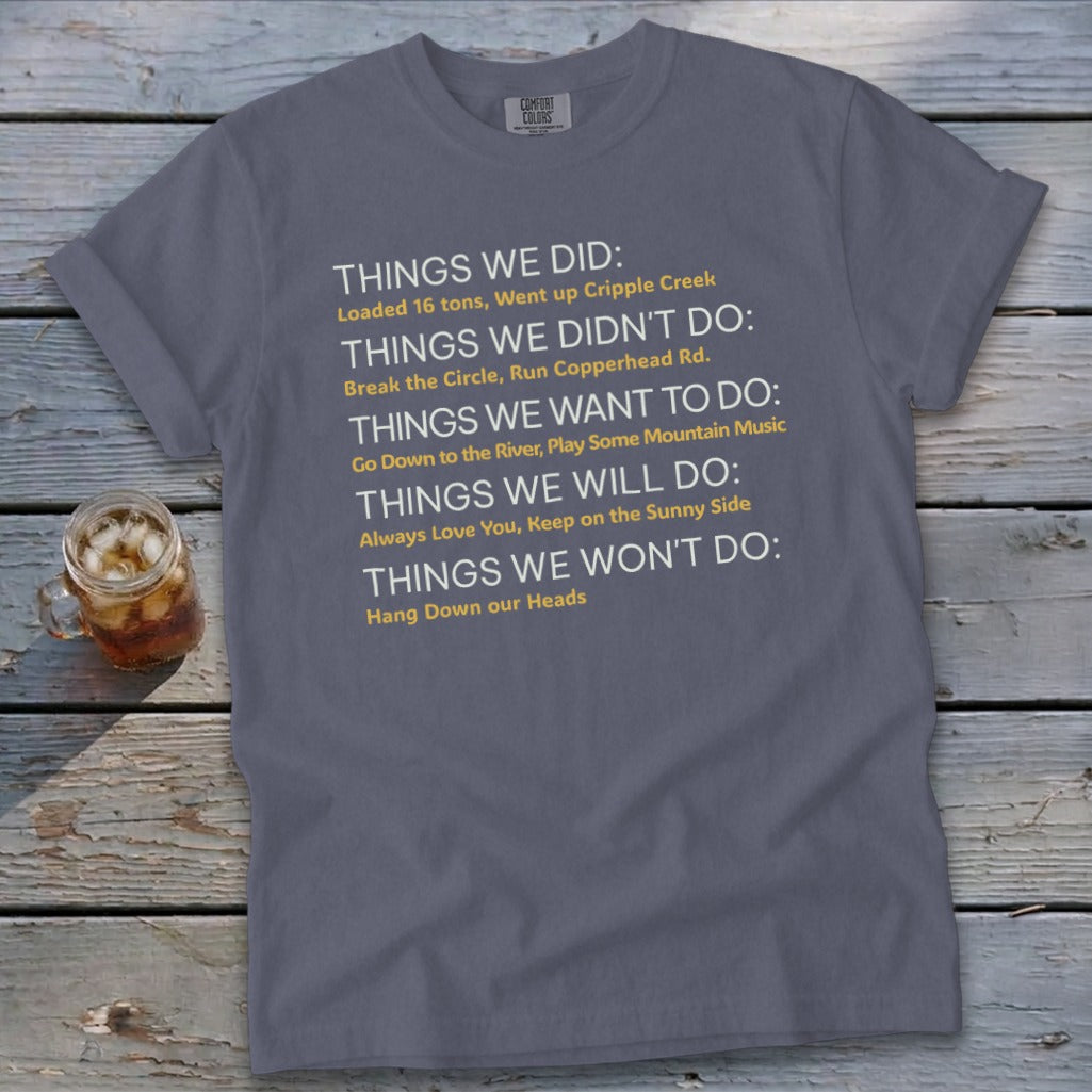 Gray t-shirt with white and yellow text listing things done, not done, want to do, will do, and won't do.