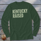 Dark green long sleeve shirt with "KENTUCKY RAISED" in light beige text.