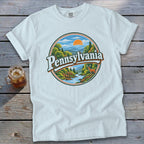 White t-shirt featuring a circular graphic with "Pennsylvania" and a scenic landscape.