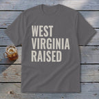 Grey t-shirt with "WEST VIRGINIA RAISED" in beige text.
