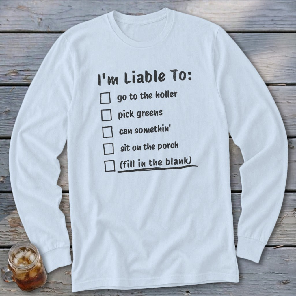 White long-sleeve shirt with a checklist of funny phrases and a fill-in-the-blank option.