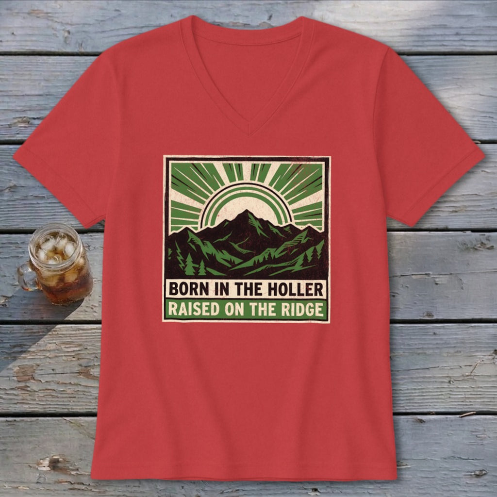 Red V-neck t-shirt featuring a green graphic of mountains, trees, and sunbursts with text reading Born in the Holler Raised on the Ridge.