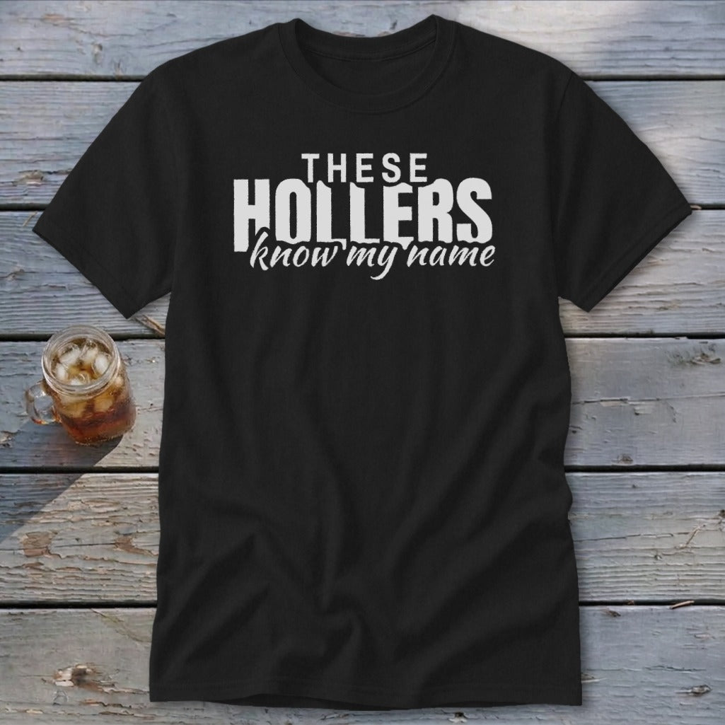 Black t-shirt with white text "THESE HOLLERS know my name".