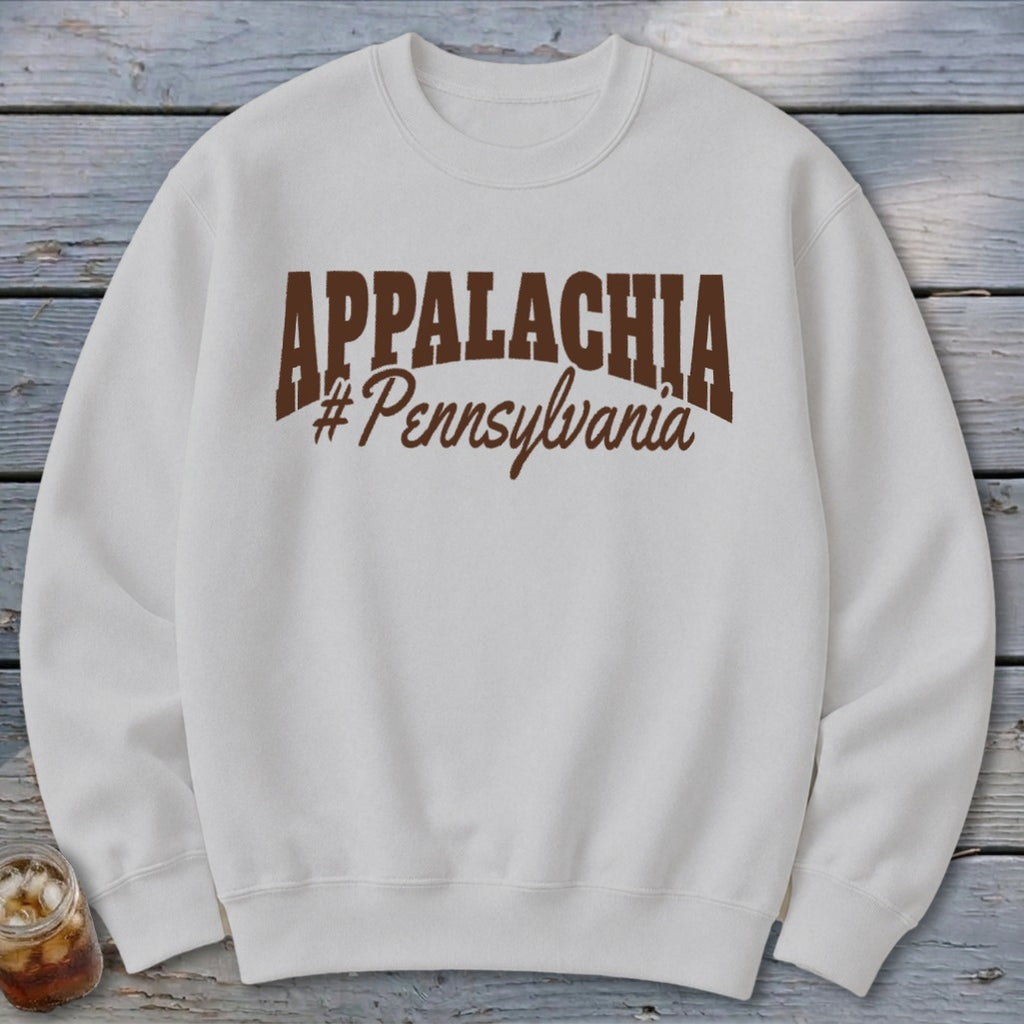 White crewneck sweatshirt with "APPALACHIA #Pennsylvania" text in brown.
