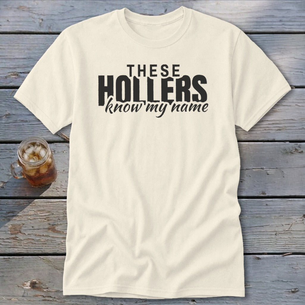 Cream t-shirt with black text that reads "THESE HOLLERS know my name".
