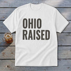 White t-shirt with "OHIO RAISED" in bold gray text.