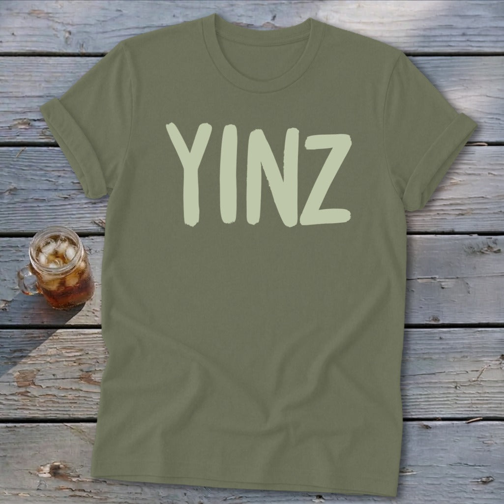 Olive green t-shirt with "YINZ" printed in a lighter green.