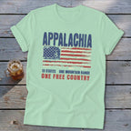 Light green t-shirt with distressed American flag graphic and text reading Appalachia 13 States One Mountain Range One Free Country.