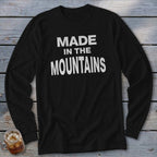 Black long-sleeve shirt with white text reading "MADE IN THE MOUNTAINS".