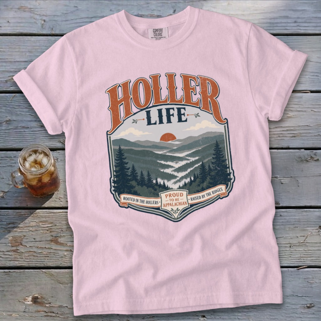 Pink t-shirt with "Holler Life" mountain graphic and text.