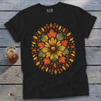 Black t-shirt with a circular autumn leaf and acorn design in orange, yellow, and green.