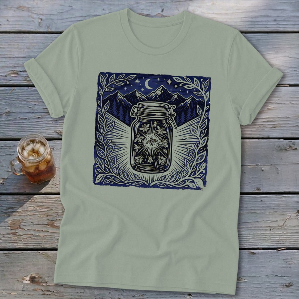 Light green t-shirt with a jar full of fireflies and a mountainous night sky.