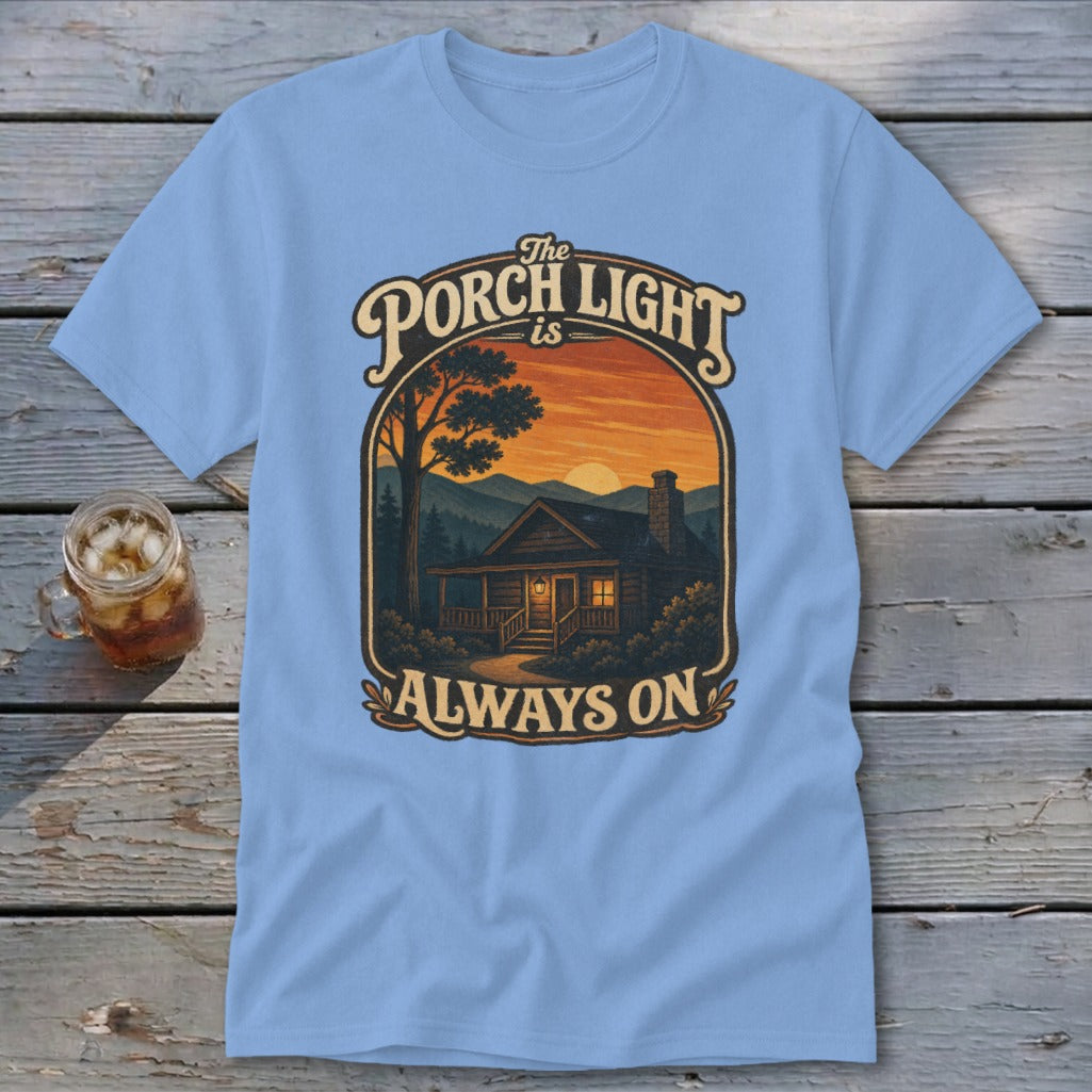 Light blue t-shirt with cabin scene and text "The Porch Light is Always On".