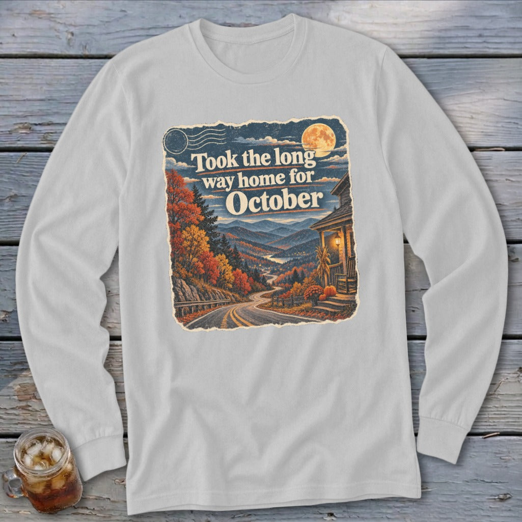 Long sleeve shirt with graphic: "Took the long way home for October" and autumn mountain scene.