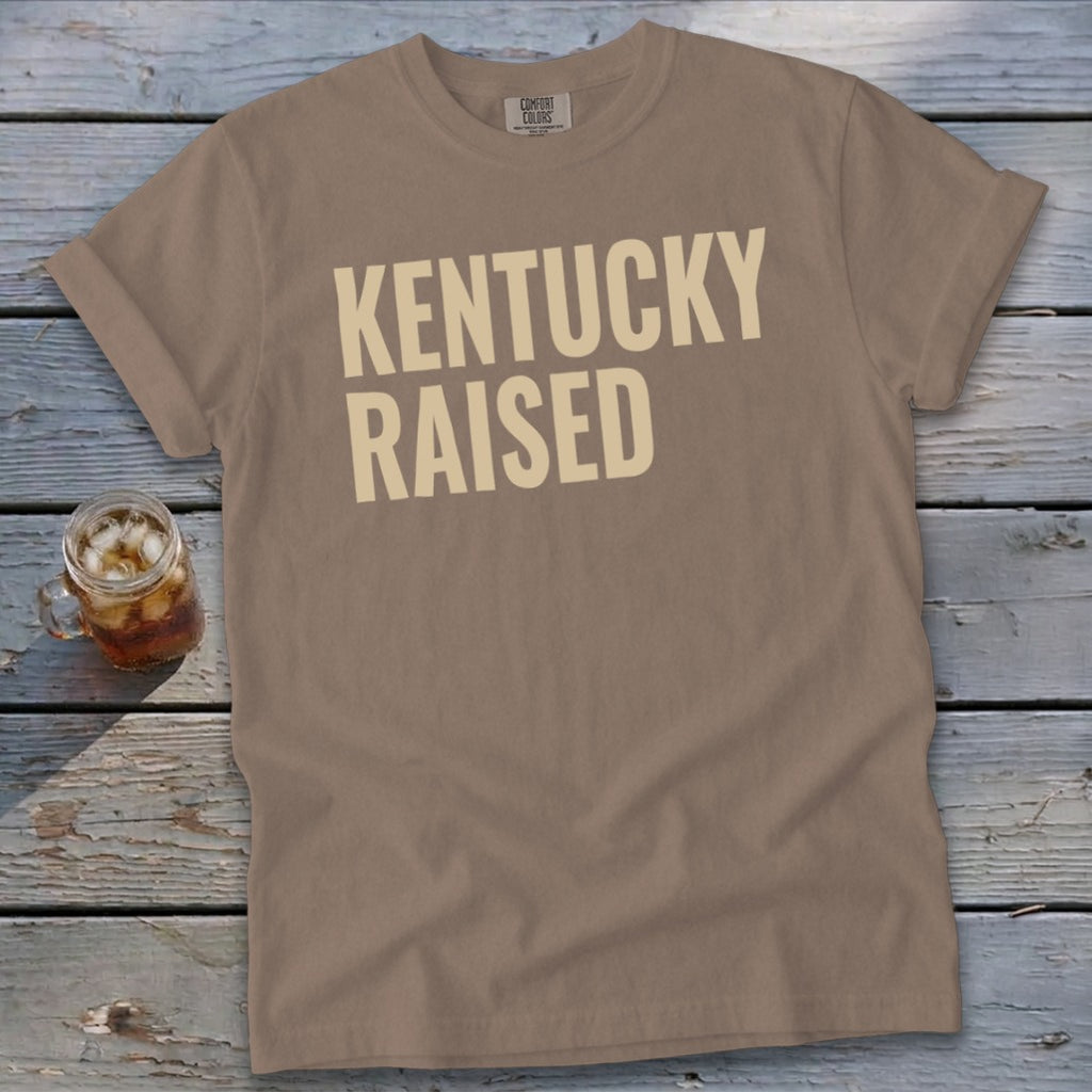 Brown t-shirt with "KENTUCKY RAISED" text and a glass of iced tea.