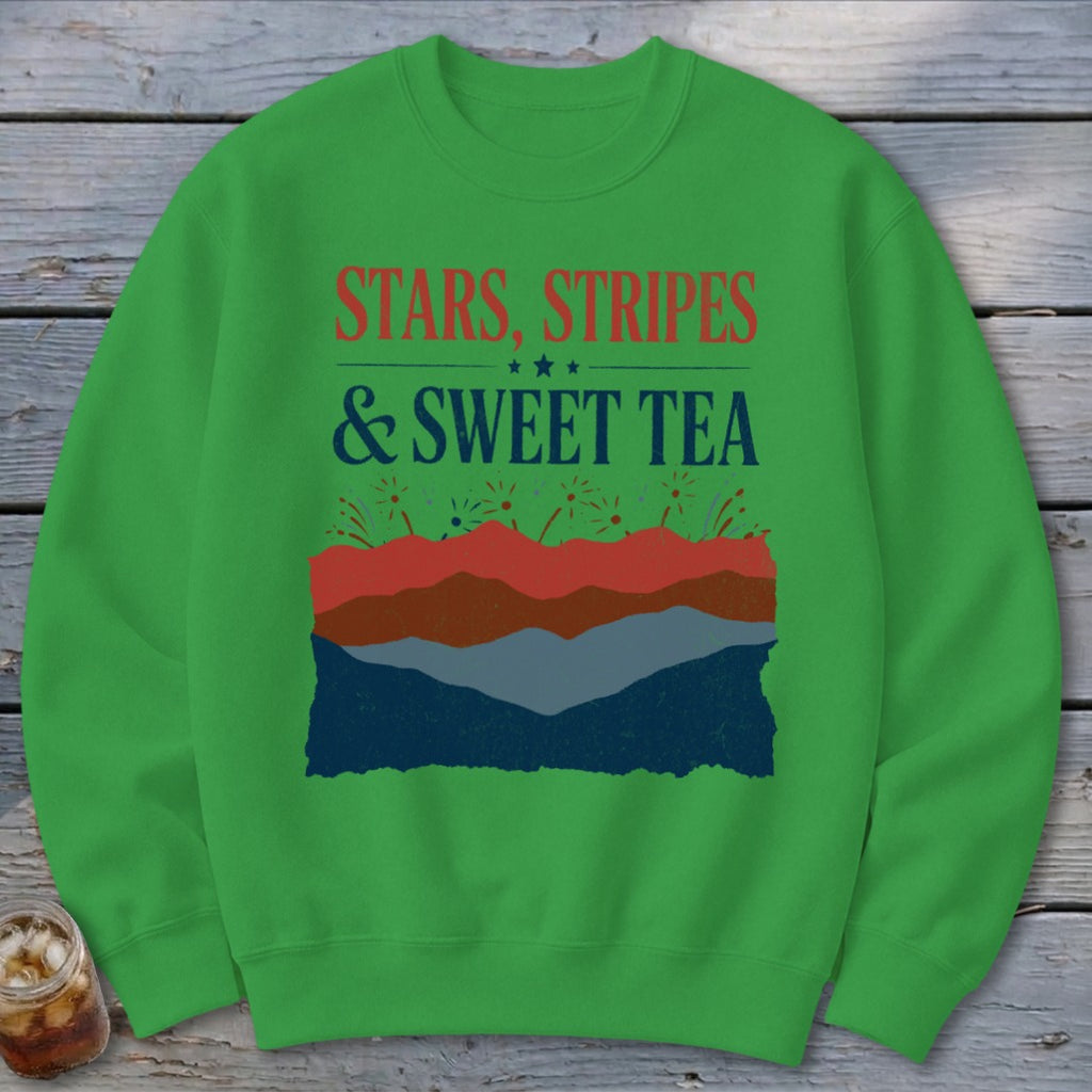 Green crewneck sweatshirt featuring the text Stars, Stripes, and Sweet Tea above layered patriotic graphics.