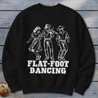 Black sweatshirt with a white graphic of three people dancing, one playing a fiddle, with "FLAT-FOOT DANCING" text.