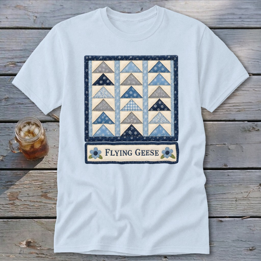 Light blue t-shirt with a "Flying Geese" quilt block design and text.