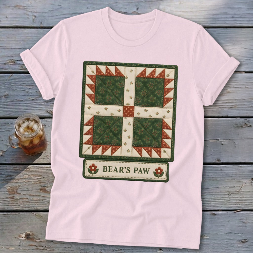 Pink t-shirt with a quilt block design labeled "BEAR'S PAW".